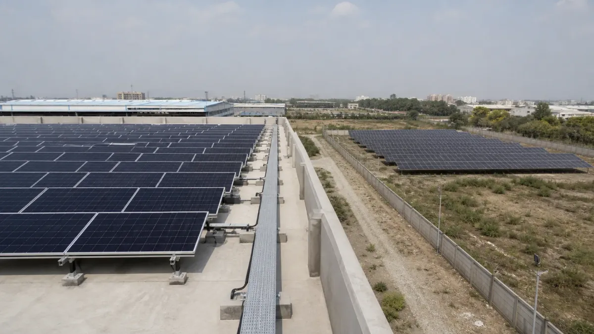 Industrial rooftop and ground-mounted solar arrays shown side by side