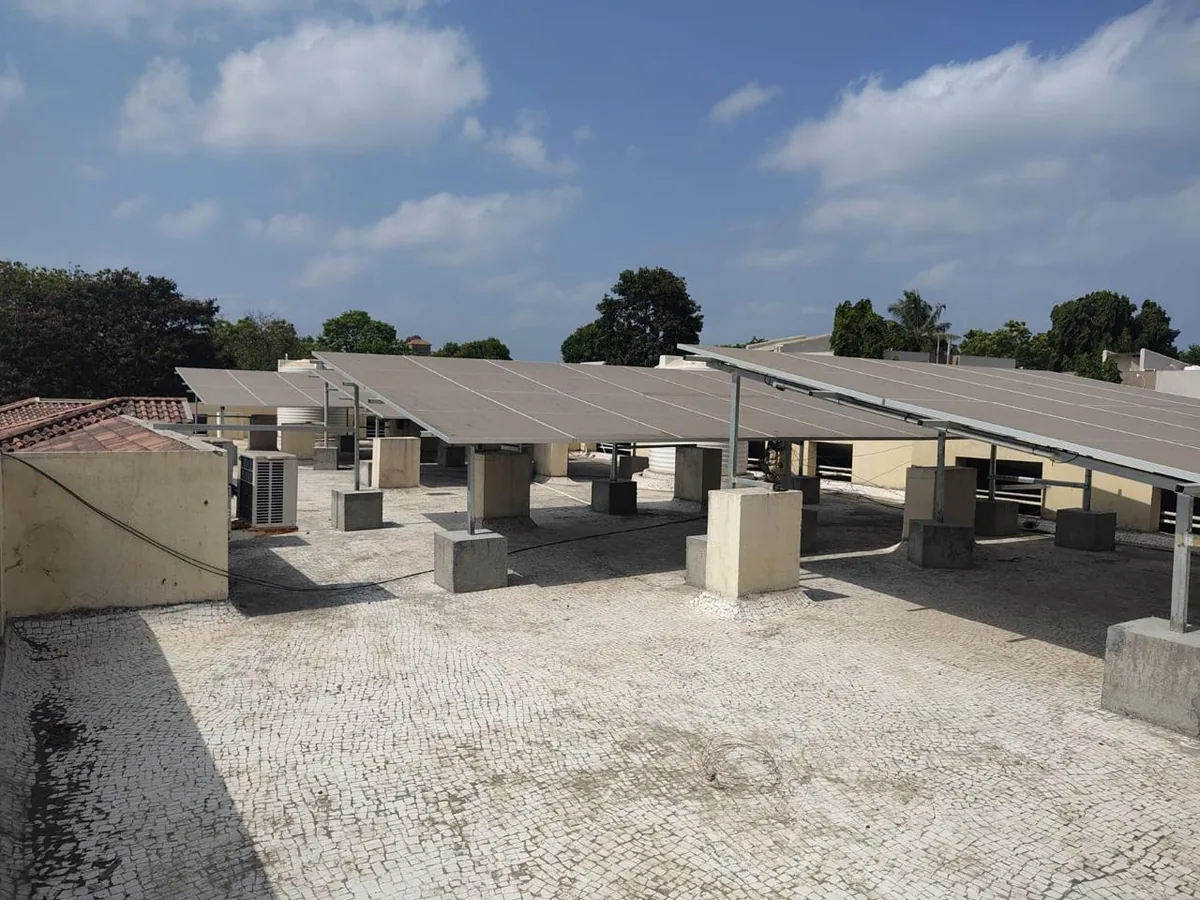 Alternate wide view of a completed multi-row rooftop solar installation with clear access space