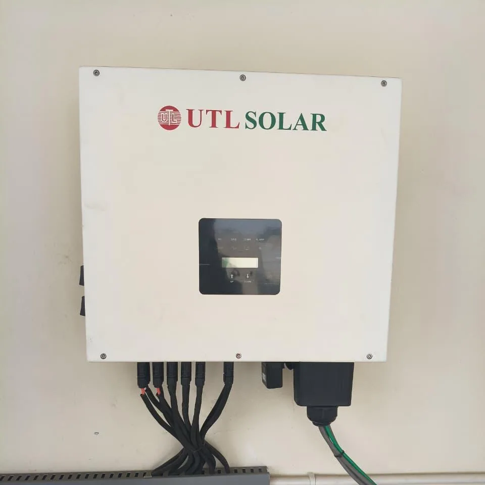 Wall-mounted UTL solar inverter with grouped DC inputs and protected AC cable entry